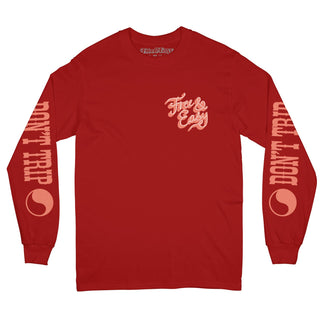 Lasso long sleeve tee in red with a white and pink graphic on a white background -Free & Easy