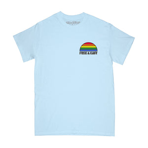 Sunset Rainbow Short Sleeve Tee in light blue with a multicolor rainbow design on a white background - Free & Easy