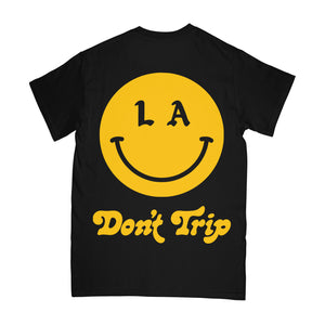 Be Happy LA SS Tee in black with a yellow LA Don't Trip smiley face design on a white background -Free & Easy