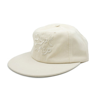 Don't Trip cream hat with white embroidered Don't Trip logo on white background - Free & Easy